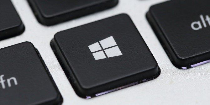 Close-up of a keyboard with a black Windows key featuring the Windows logo.