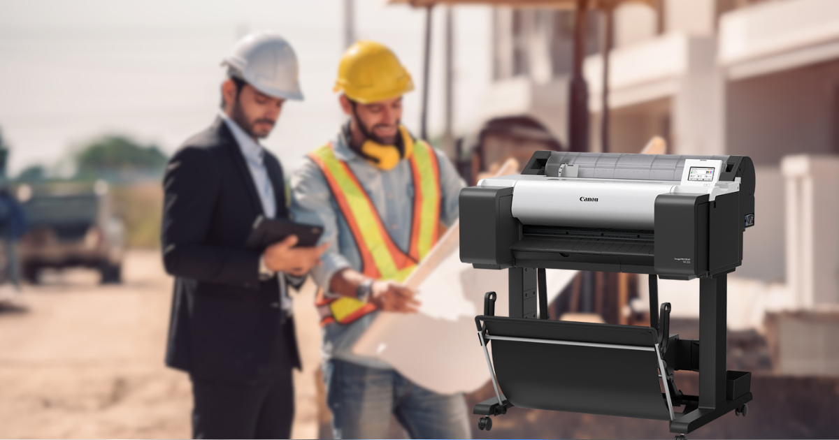 Canon large-format printer for architectural and engineering plans, with construction professionals reviewing blueprints in the background.