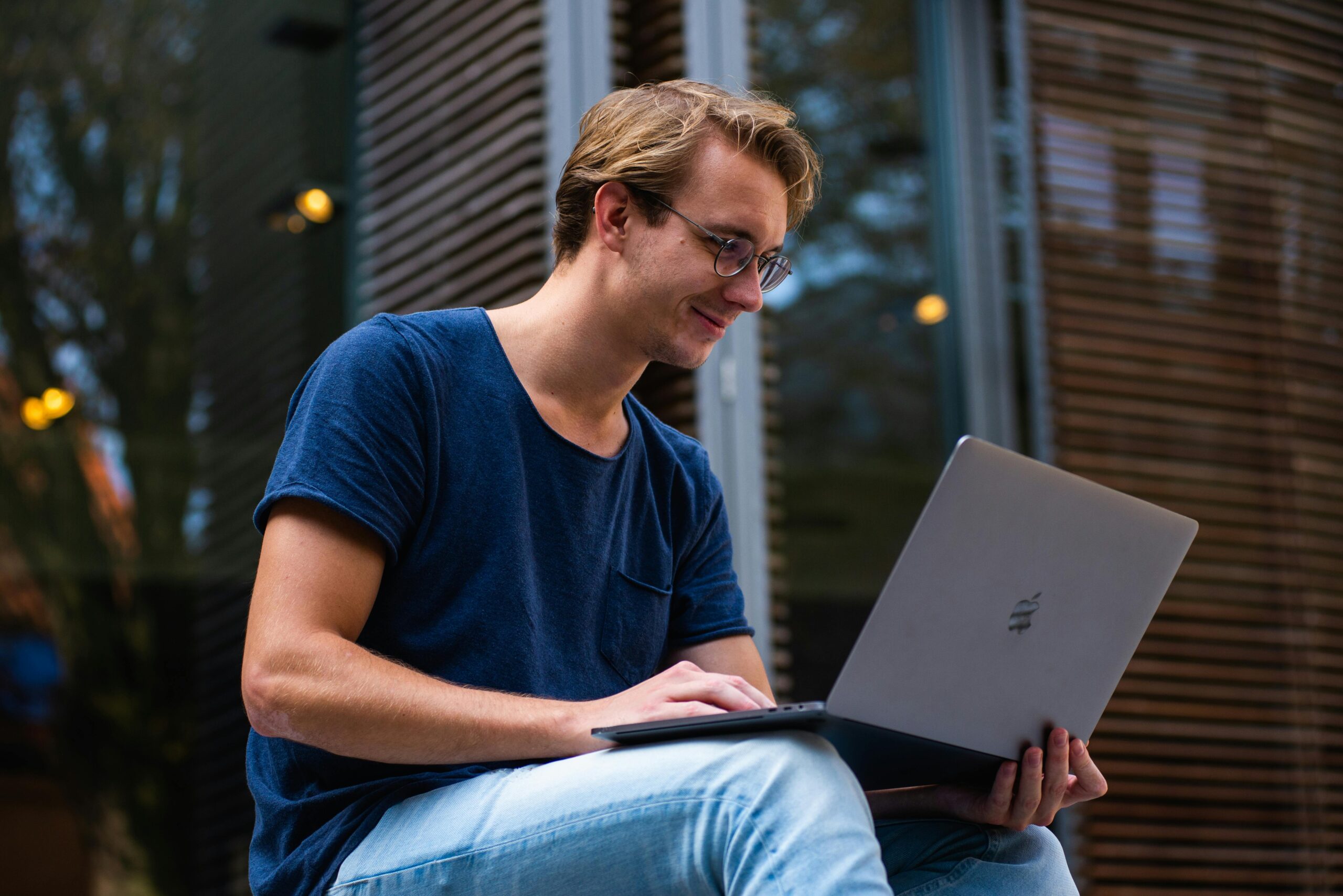 An image of a man using a laptop