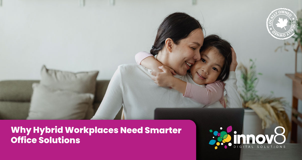 A smiling woman working remotely from home, holding her young daughter while sitting in front of a laptop. Caption reads: “Why Hybrid Workplaces Need Smarter Office Solutions” with the Innov8 Digital Solutions logo.