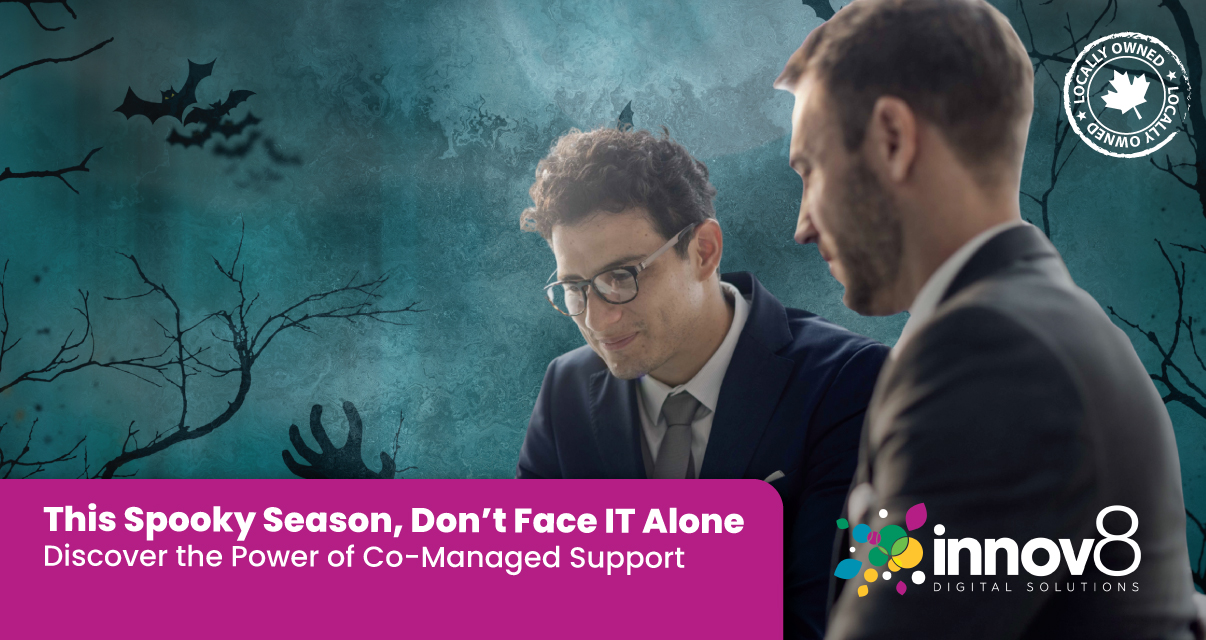 Two business professionals working together with a spooky Halloween-themed background promoting co-managed IT support.